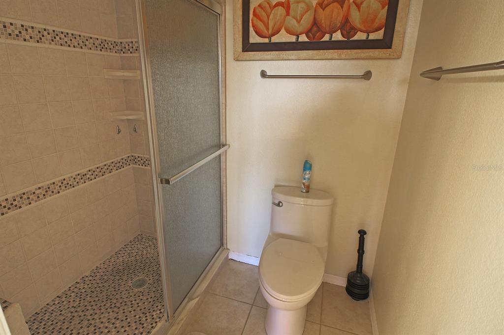 220 Coldeway Drive, Unit 123 Punta Gorda, FL 33950 - Photo 53 of 59 a white toilet sitting next to a shower
