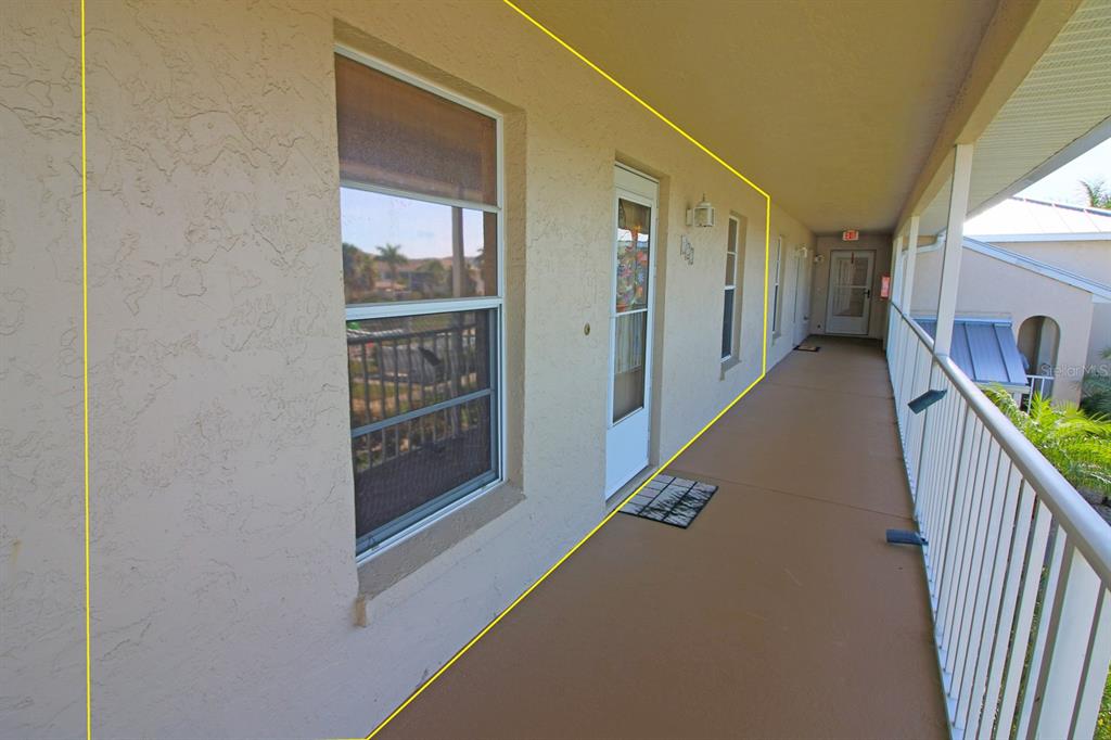 220 Coldeway Drive, Unit 123 Punta Gorda, FL 33950 - Photo 57 of 59 a view of a hallway with windows