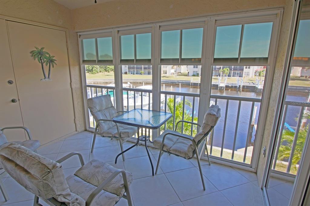 220 Coldeway Drive, Unit 123 Punta Gorda, FL 33950 - Photo 58 of 59 a view of a dining room with furniture window and outside view