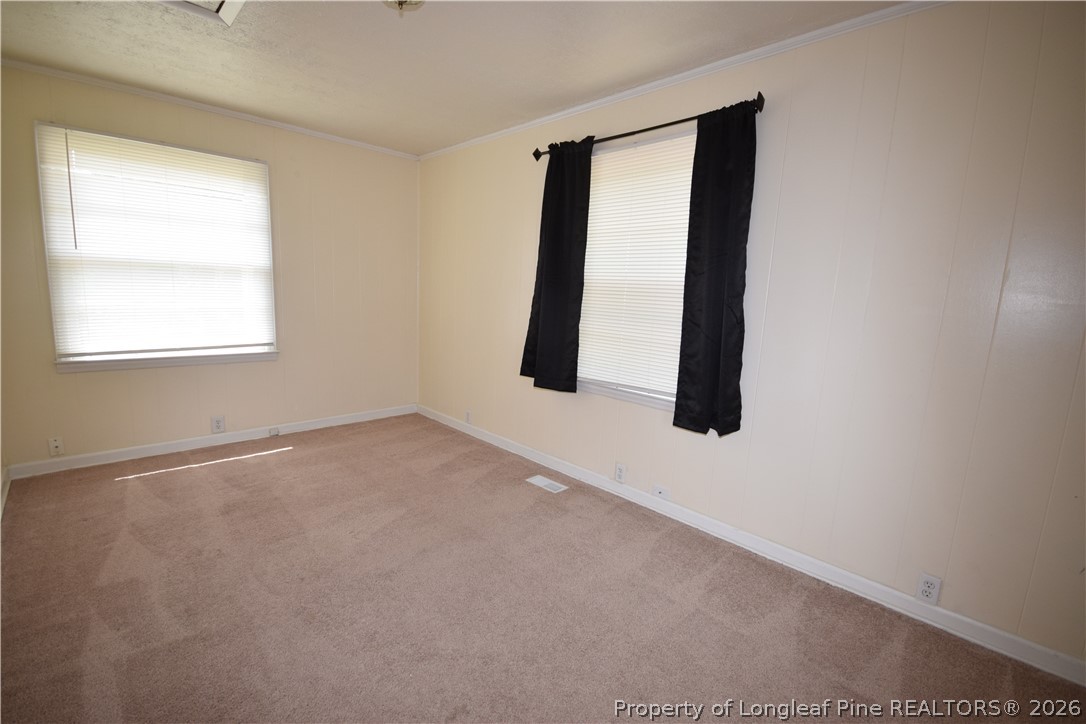 108 South 6th Street Spring Lake, NC 28390 - Photo 13 of 20 an empty room with windows