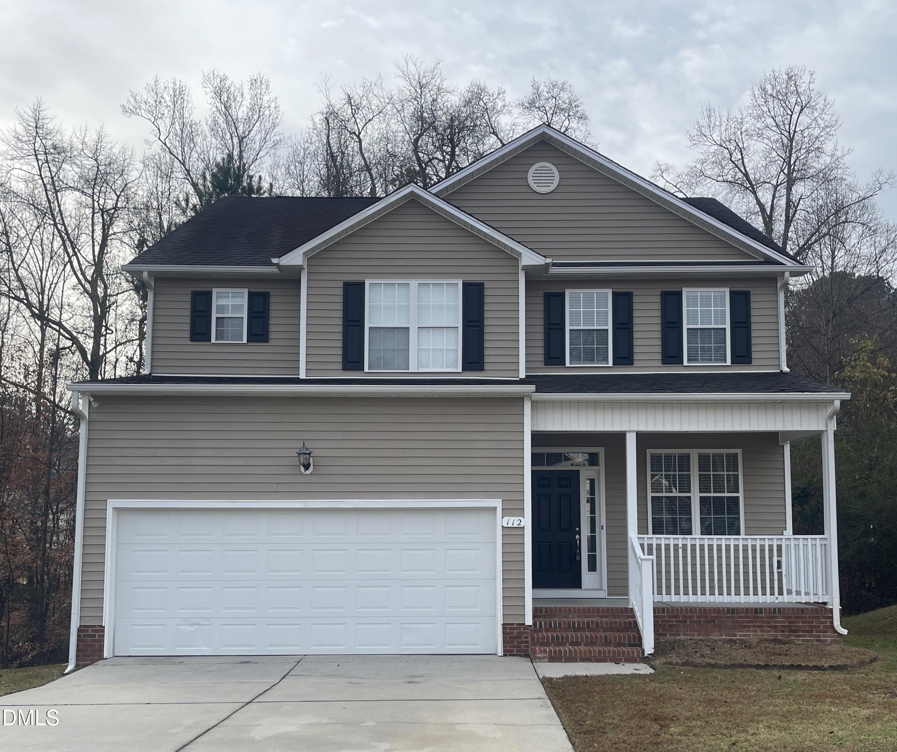 112 Taylors Creek Court Raleigh, NC 27610 - Photo 1 of 34 a front view of a house with a yard
