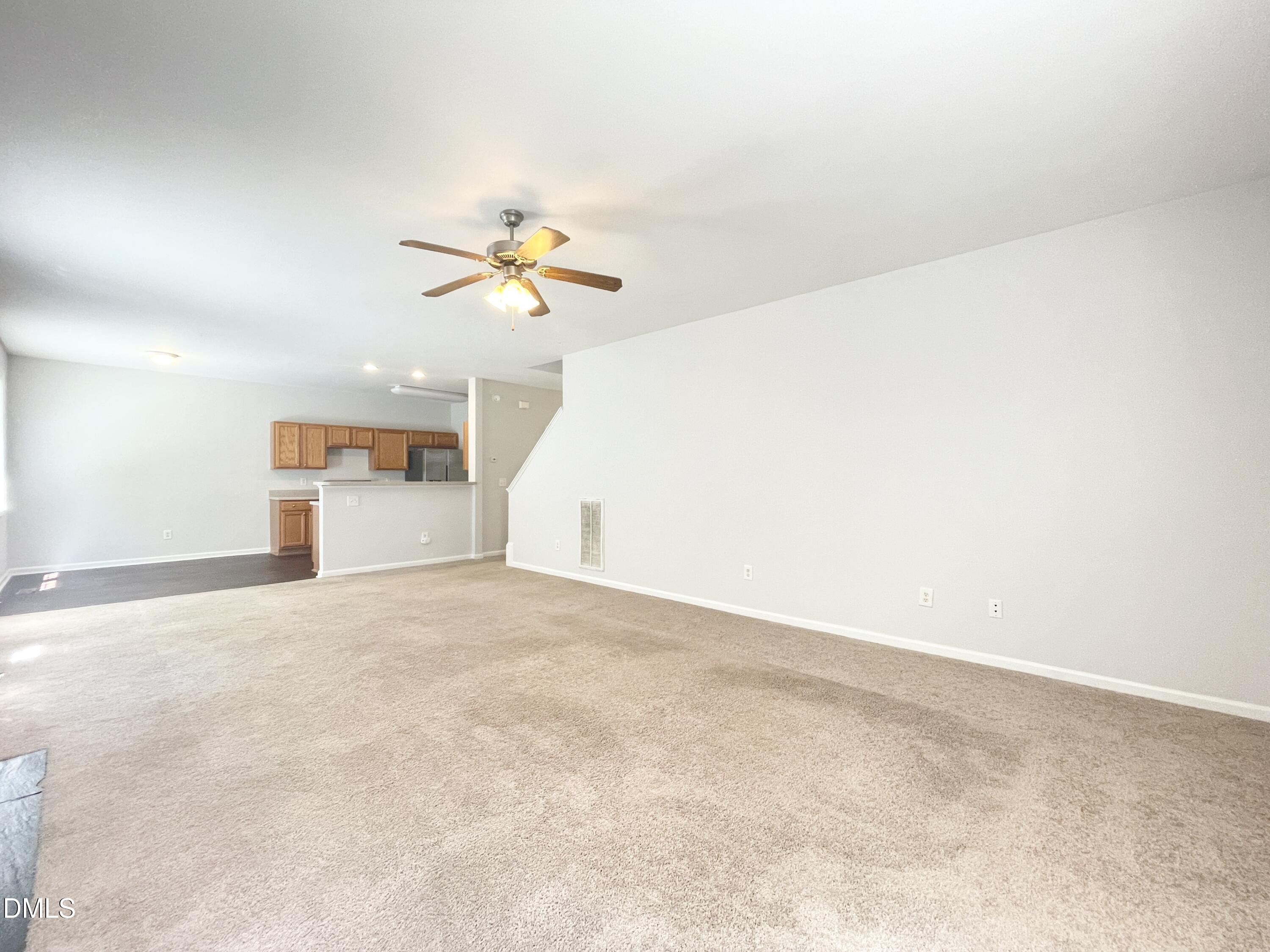 112 Taylors Creek Court Raleigh, NC 27610 - Photo 11 of 34 an empty room with a window and a ceiling fan
