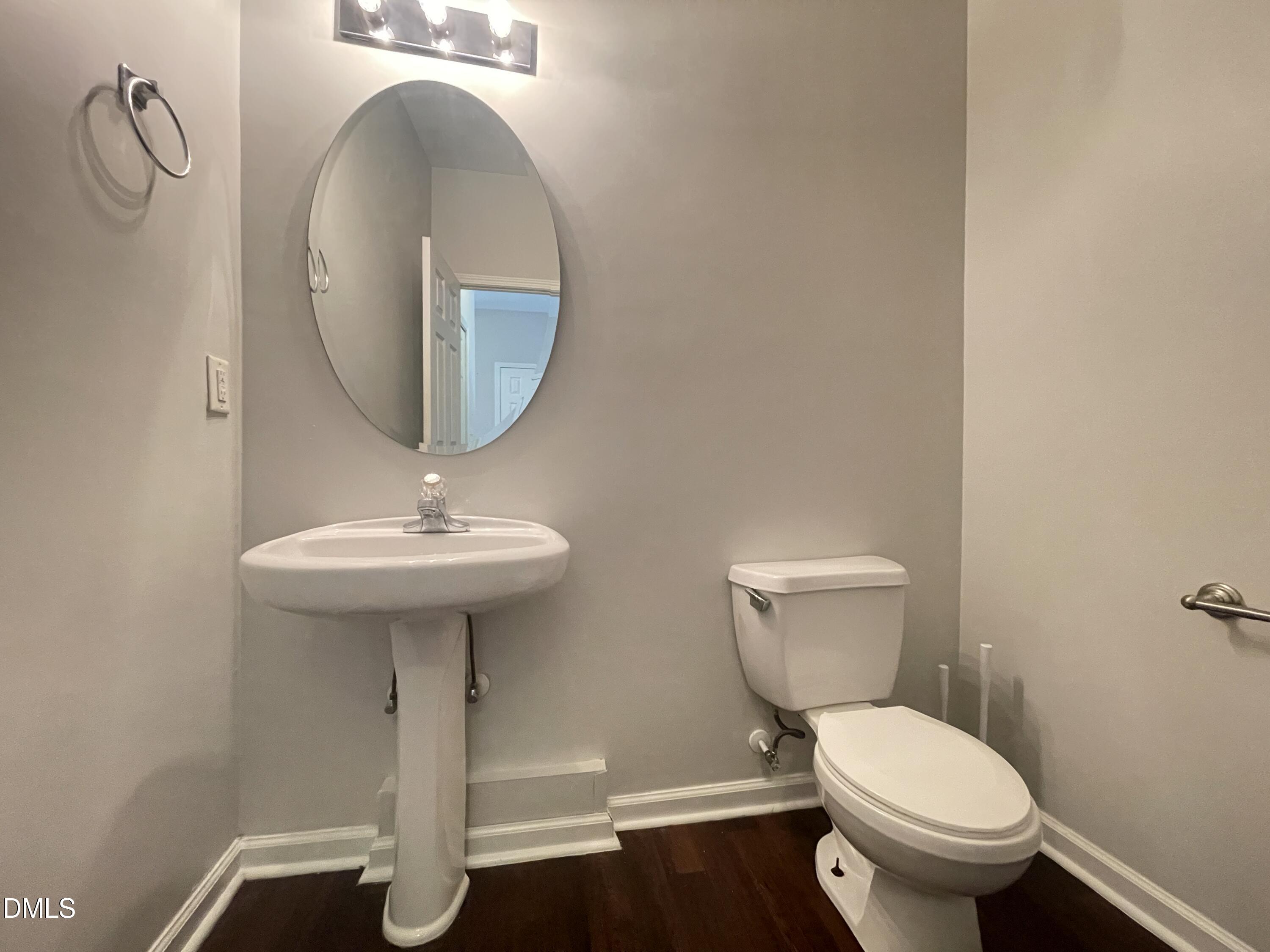 112 Taylors Creek Court Raleigh, NC 27610 - Photo 13 of 34 a bathroom with a toilet sink and mirror