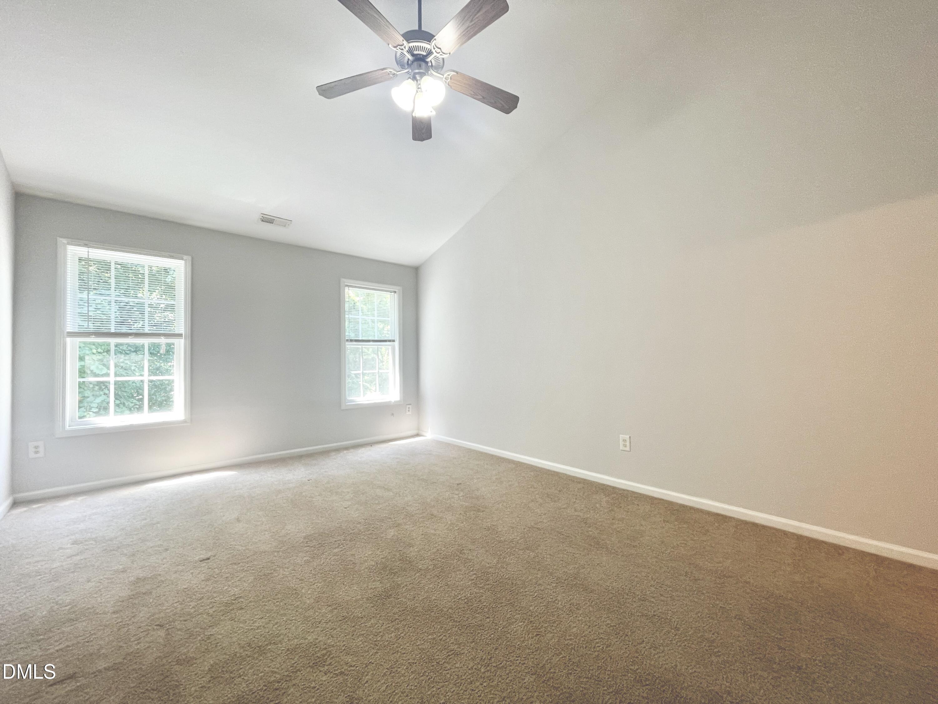 112 Taylors Creek Court Raleigh, NC 27610 - Photo 16 of 34 an empty room with a window and a fan