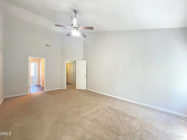 a spacious bathroom with a double vanity sink a mirror and a bathtub