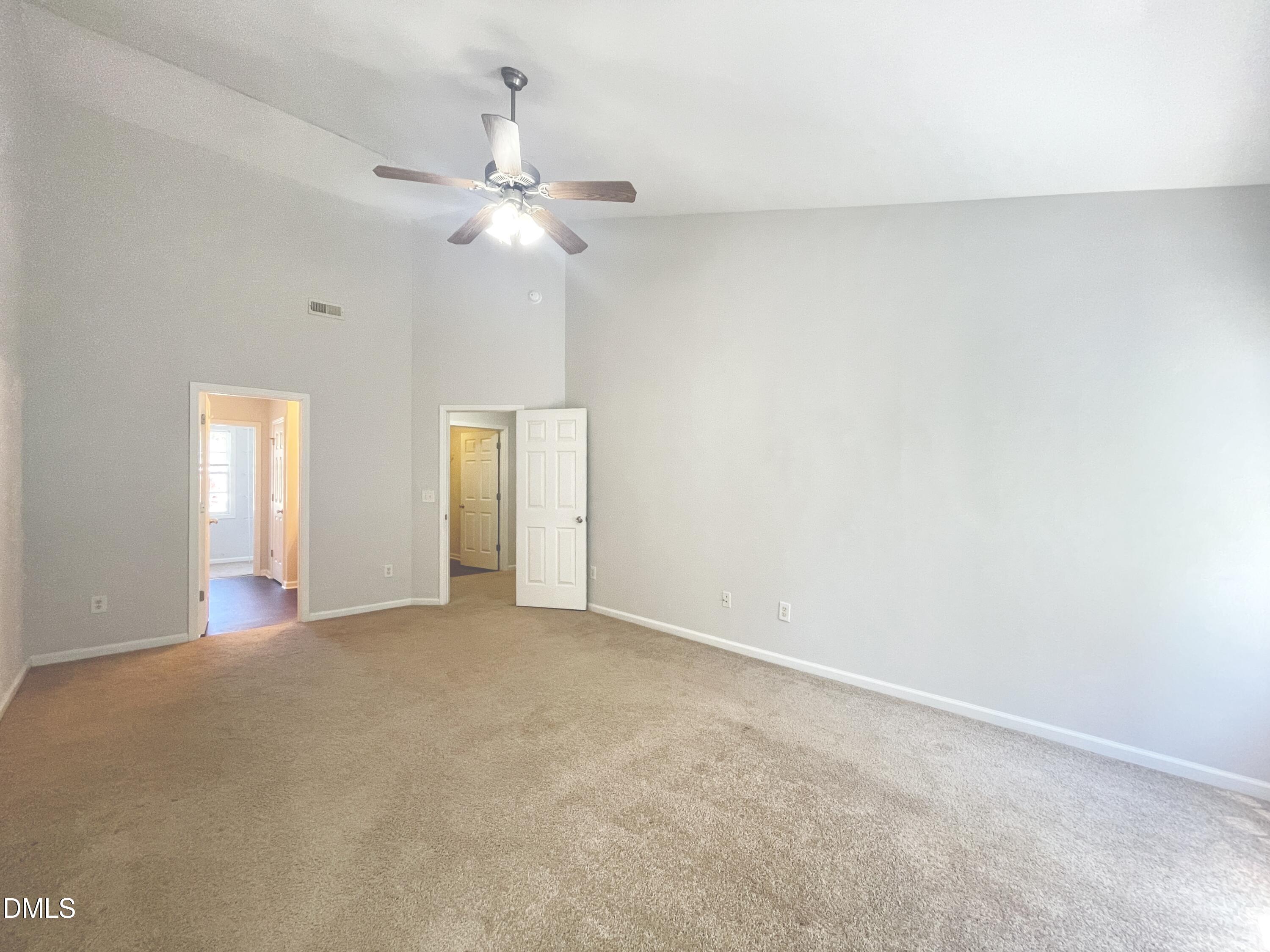 112 Taylors Creek Court Raleigh, NC 27610 - Photo 17 of 34 a view of an empty room with a chandelier fan