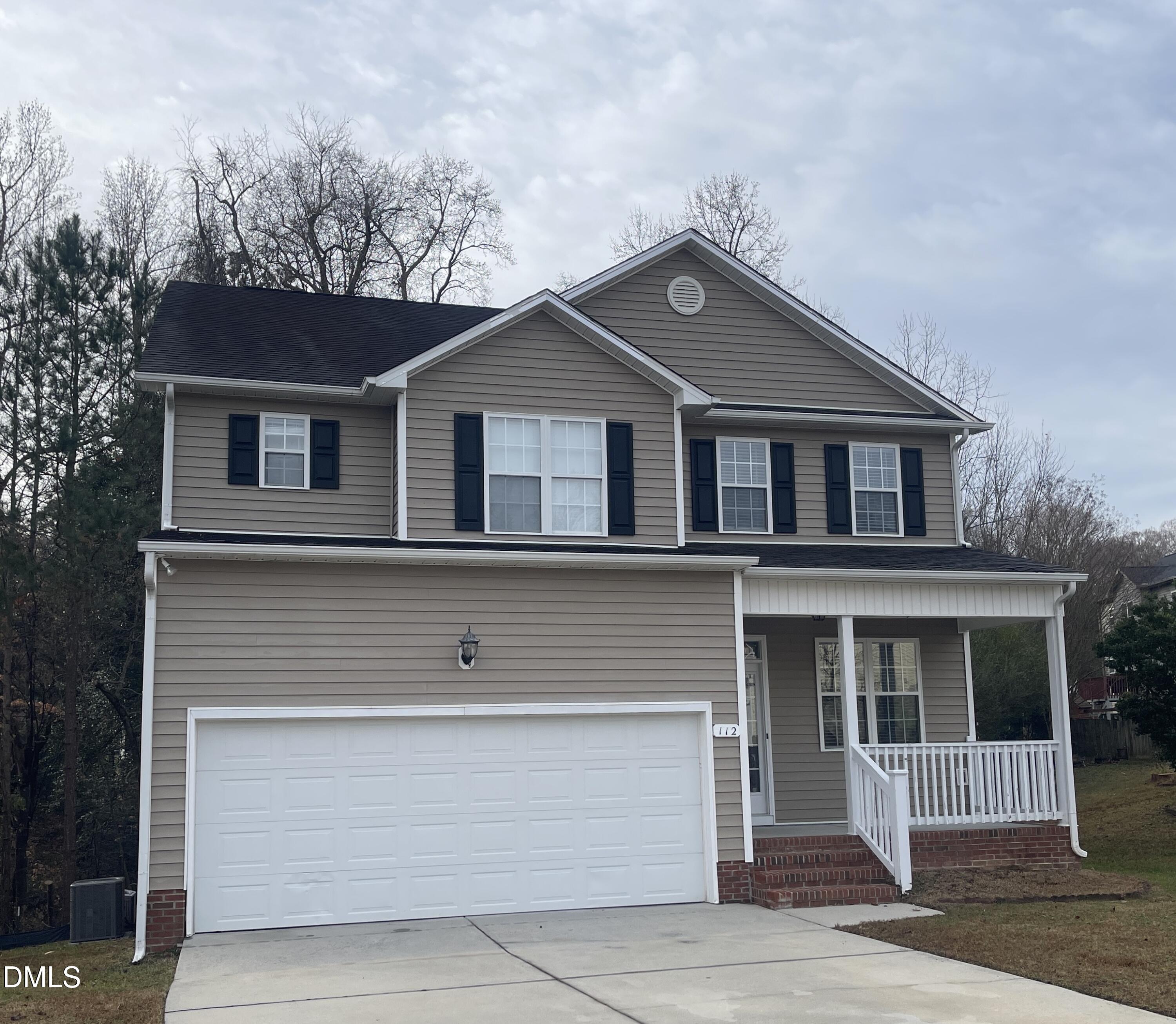 112 Taylors Creek Court Raleigh, NC 27610 - Photo 2 of 34 a front view of a house with a garage