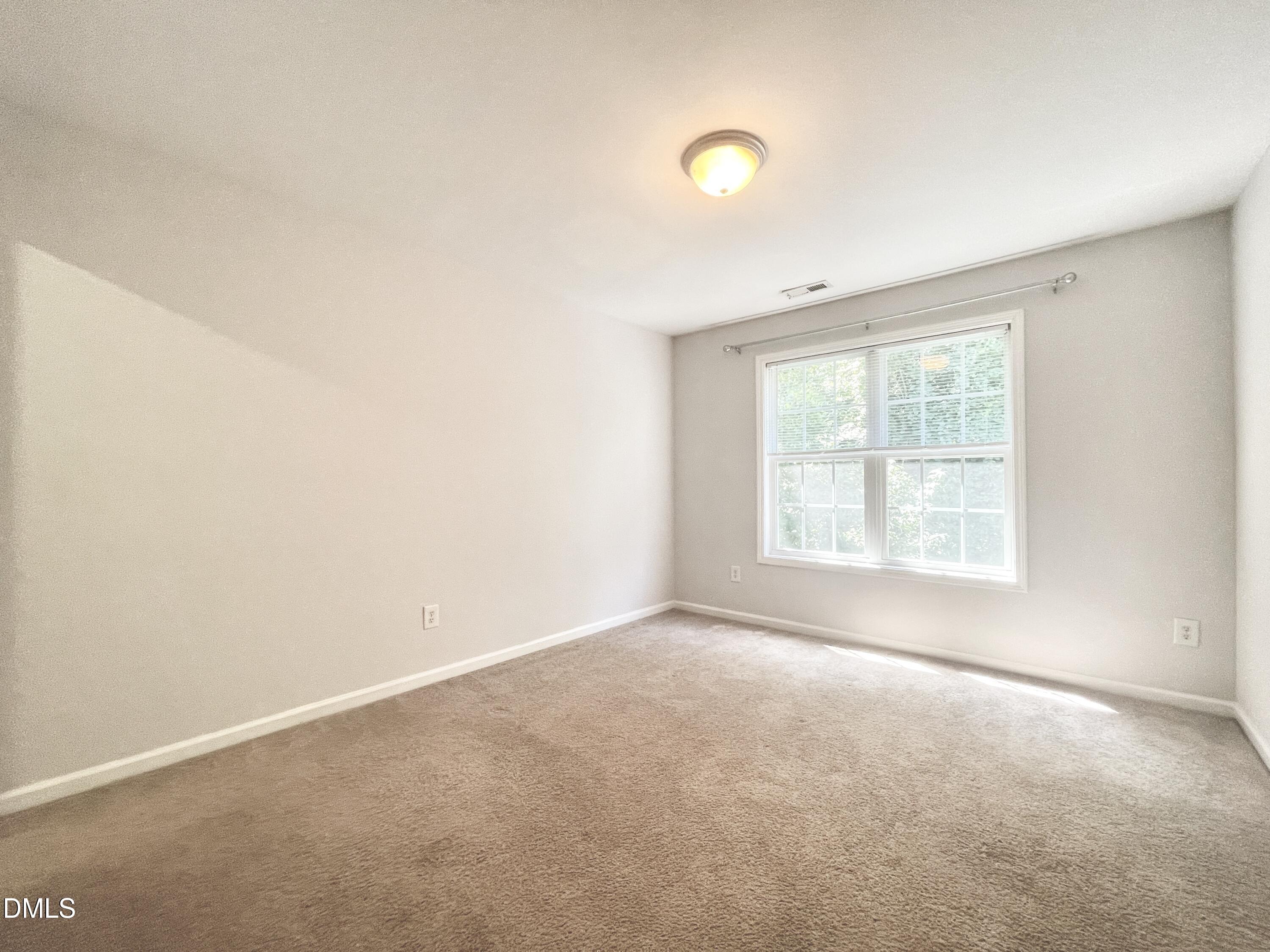 112 Taylors Creek Court Raleigh, NC 27610 - Photo 21 of 34 an empty room with a window