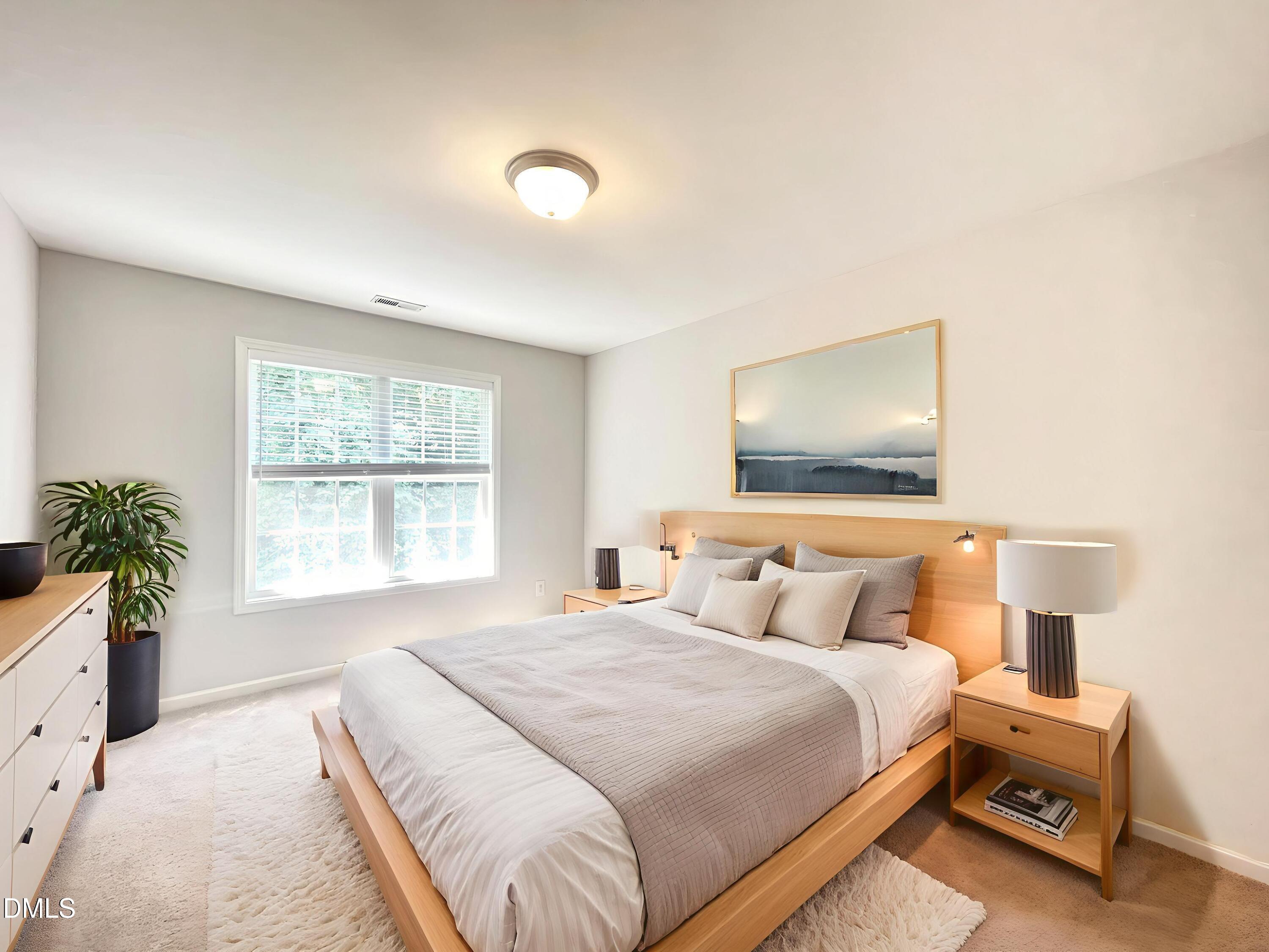 112 Taylors Creek Court Raleigh, NC 27610 - Photo 23 of 34 a bedroom with a bed and a flat screen tv