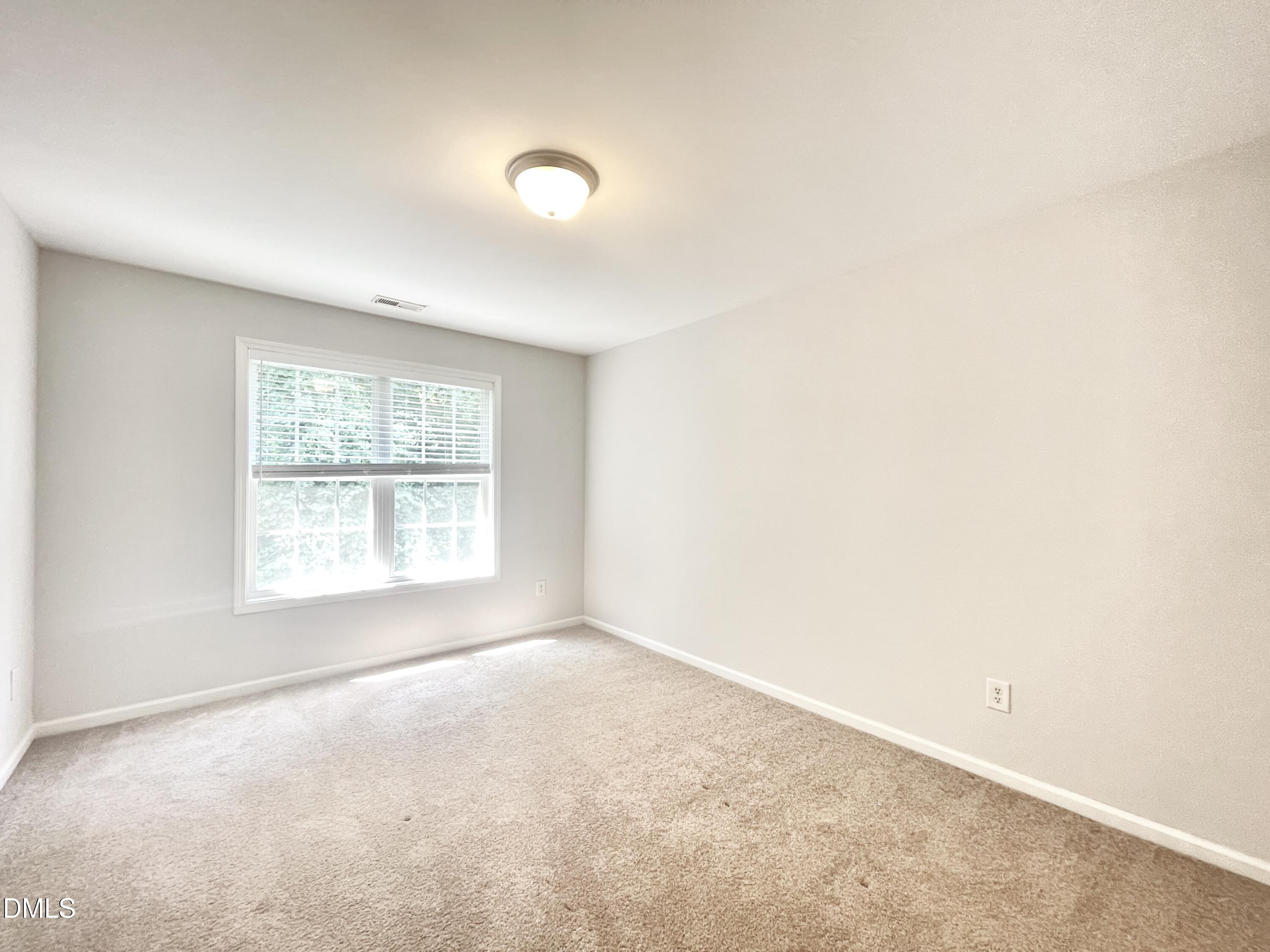 112 Taylors Creek Court Raleigh, NC 27610 - Photo 24 of 34 an empty room with a window