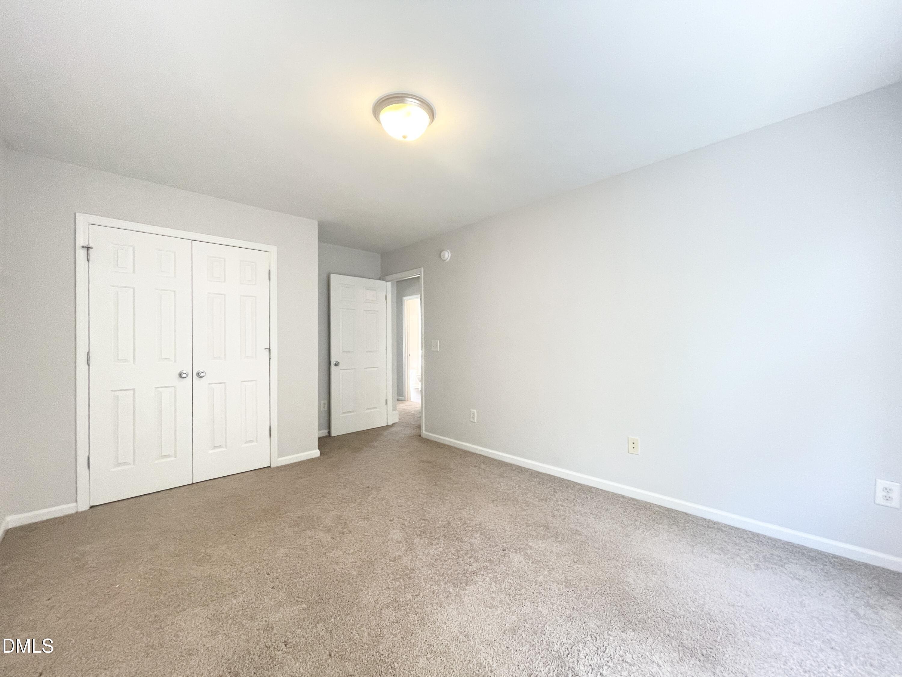 112 Taylors Creek Court Raleigh, NC 27610 - Photo 25 of 34 an empty room with an entryway