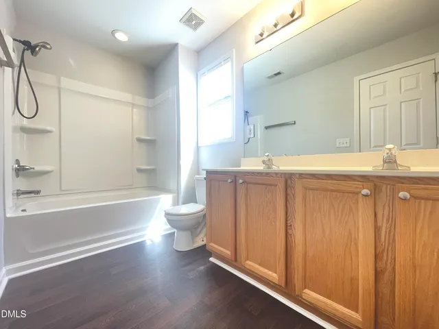 an empty room with windows and entrance