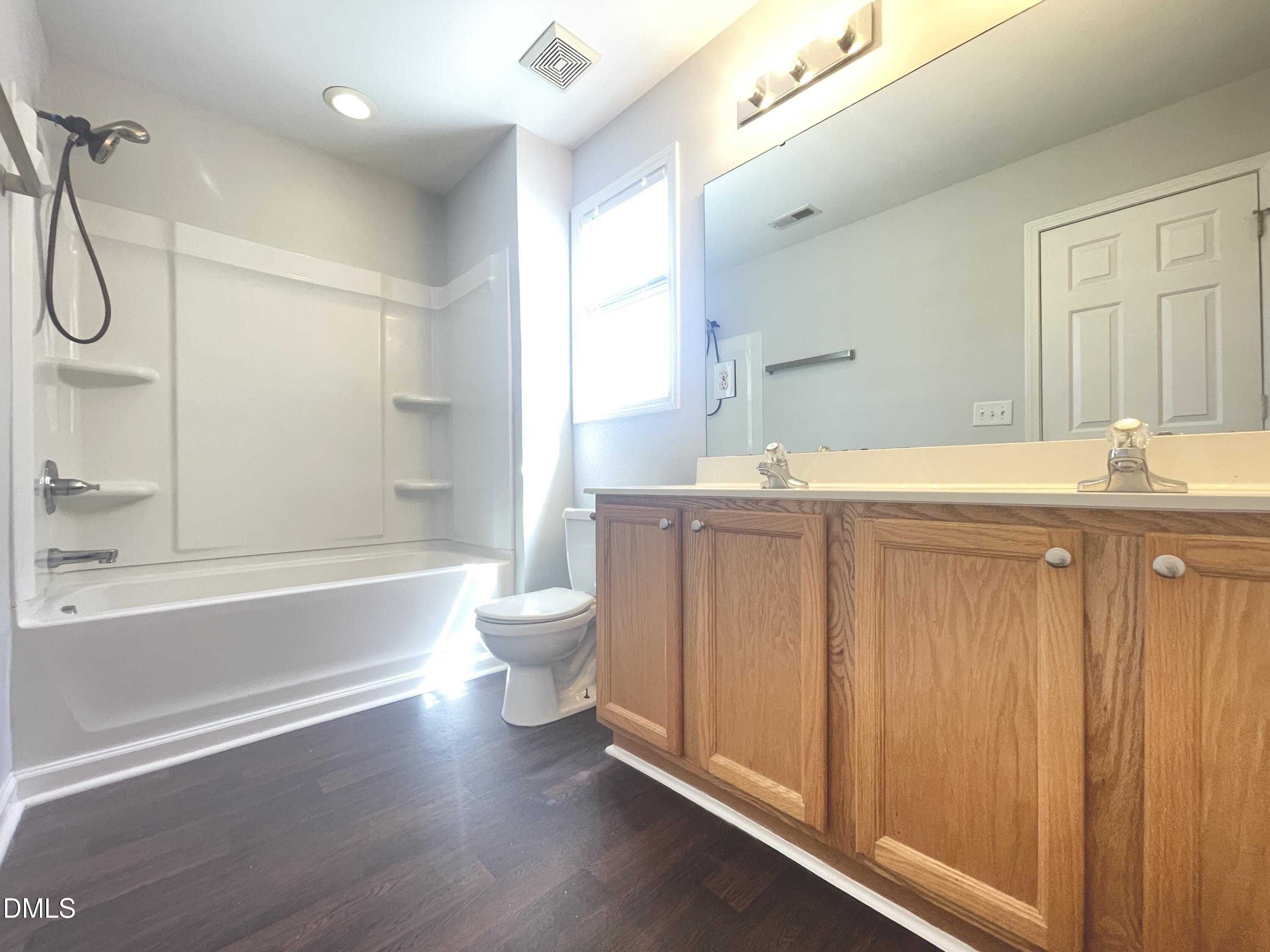 112 Taylors Creek Court Raleigh, NC 27610 - Photo 26 of 34 a bathroom with a sink a toilet and shower