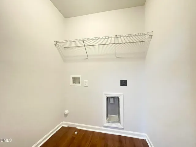 a balcony with wooden floor and fence