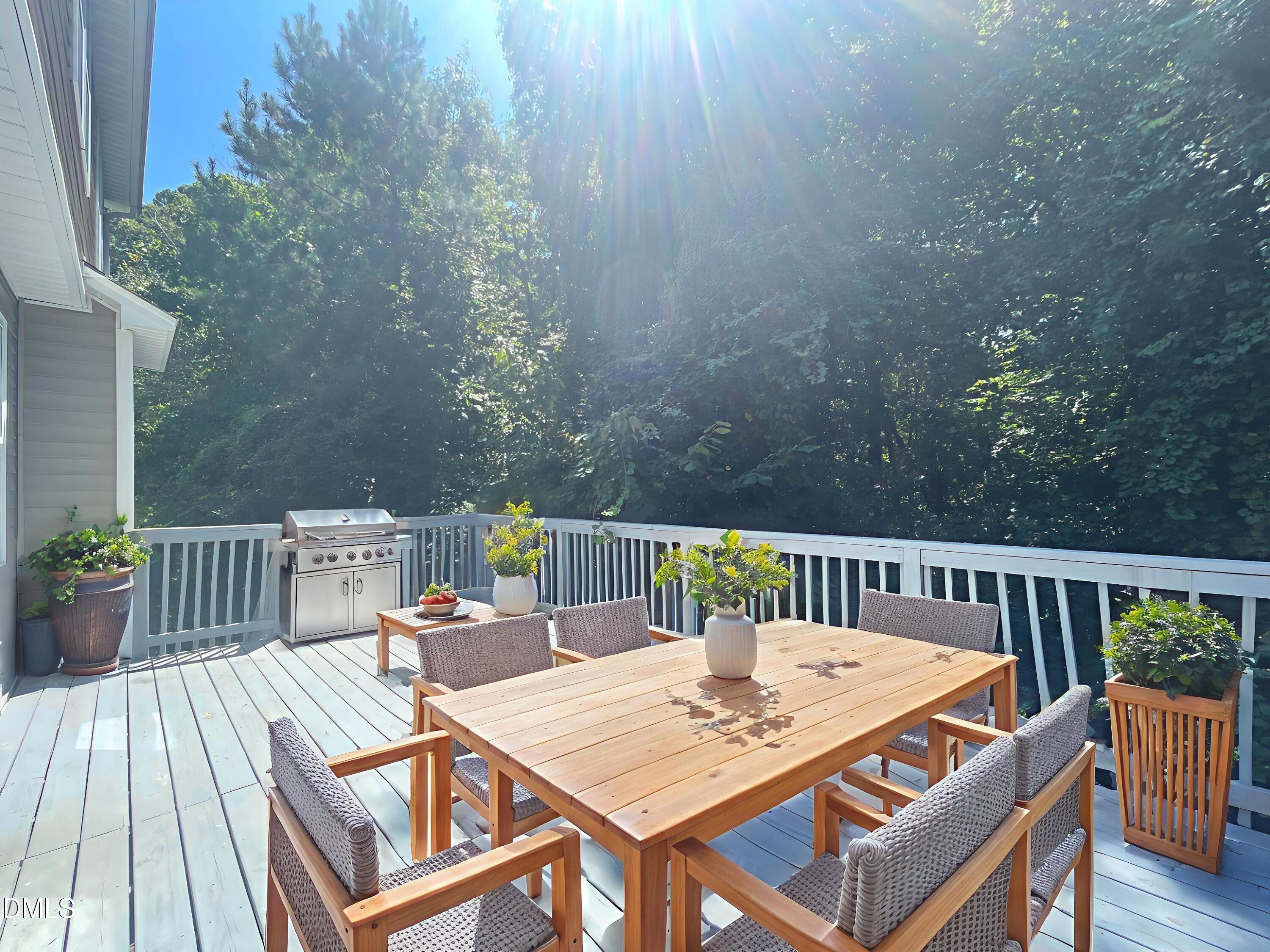 112 Taylors Creek Court Raleigh, NC 27610 - Photo 31 of 34 a view of a dinning tables and chairs on the roof deck