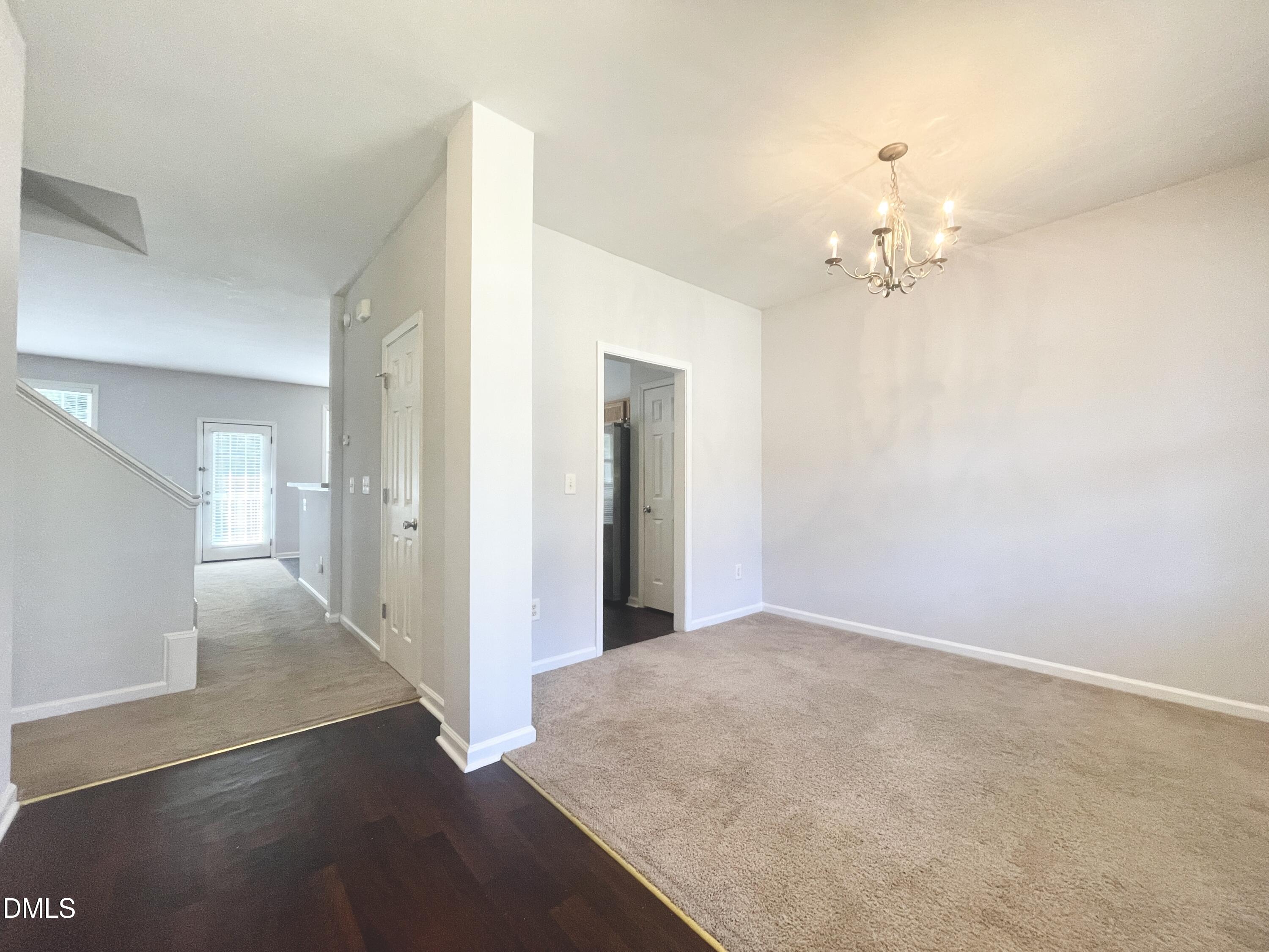 112 Taylors Creek Court Raleigh, NC 27610 - Photo 8 of 34 wooden floor in an empty room with a window