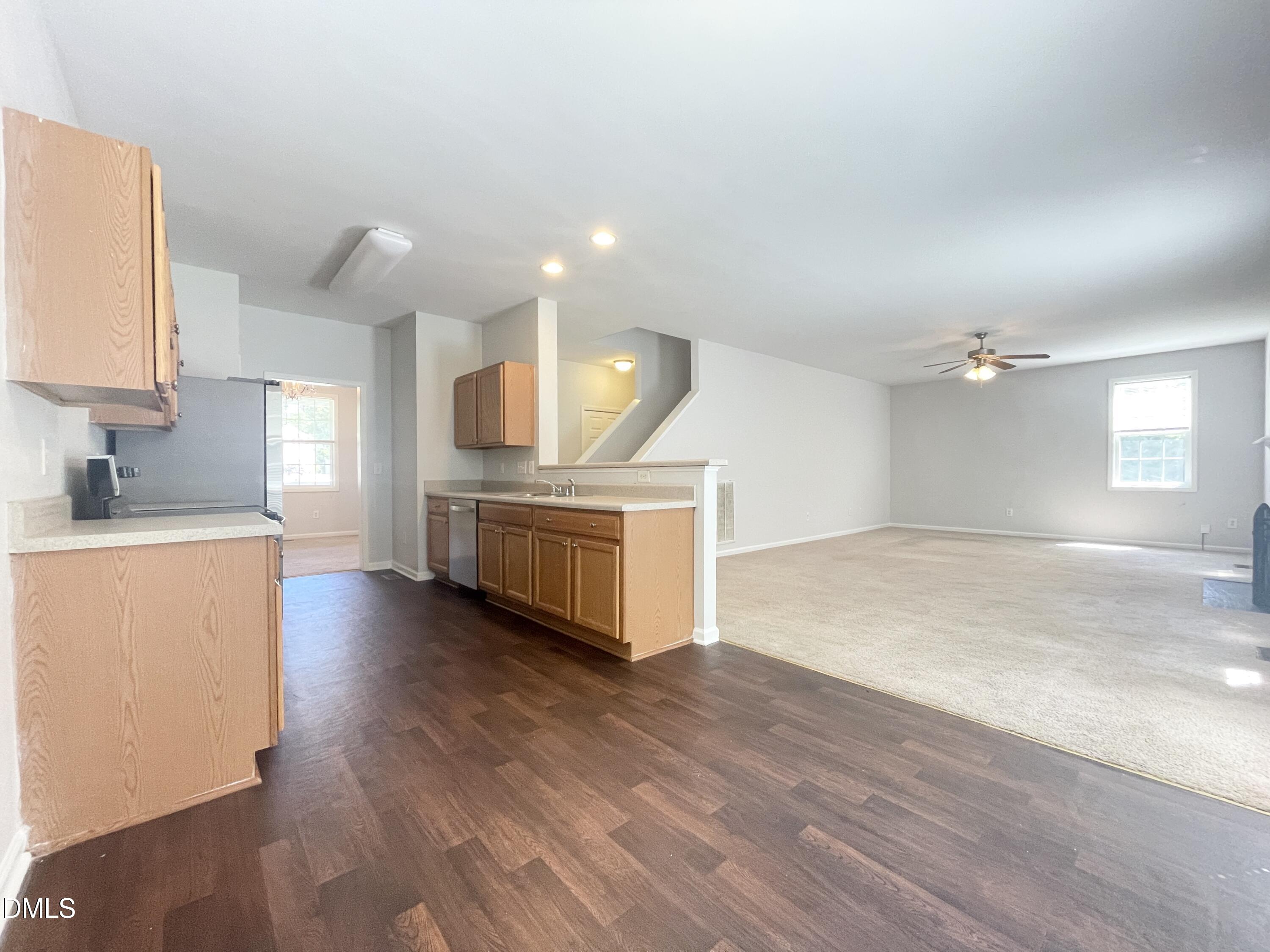 112 Taylors Creek Court Raleigh, NC 27610 - Photo 10 of 34 a view of a kitchen with a sink and a stove top oven
