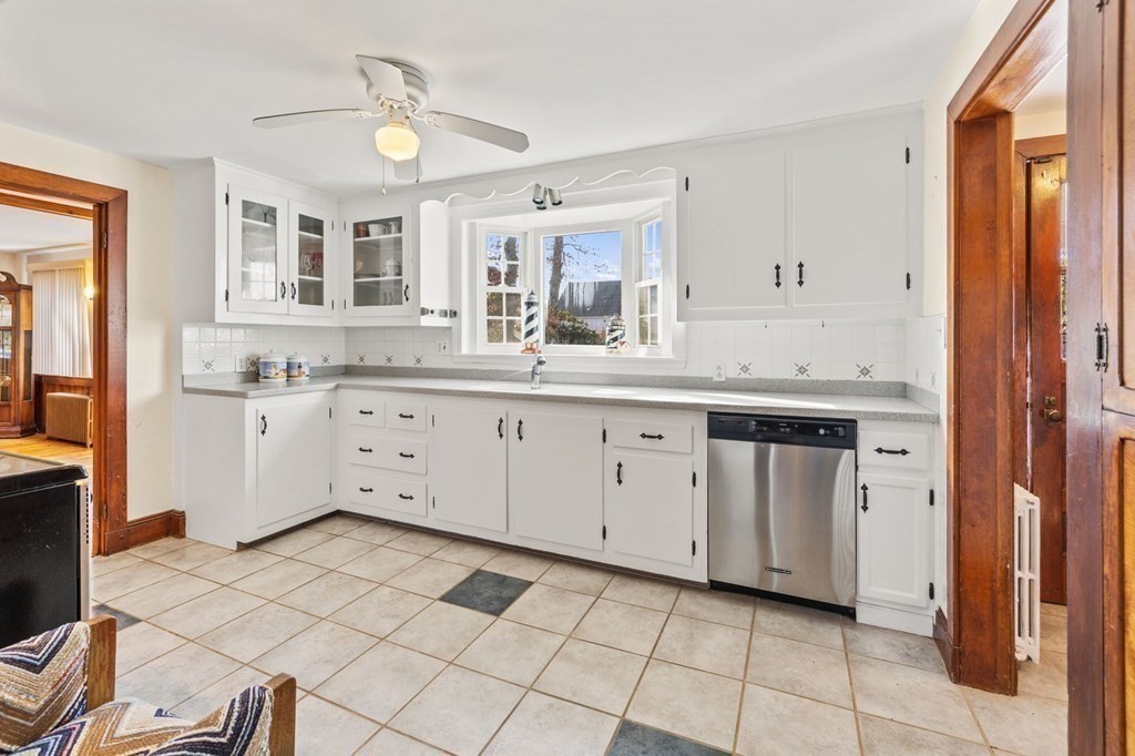 11 Russell Road Bourne, MA 02532 - Photo 4 of 16 a kitchen with a sink cabinets and window