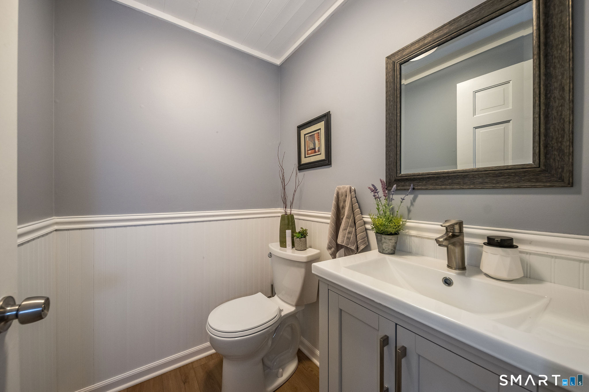 60 Bradley Corners Road Madison, CT 06443 - Photo 13 of 33 a bathroom with a sink mirror and toilet