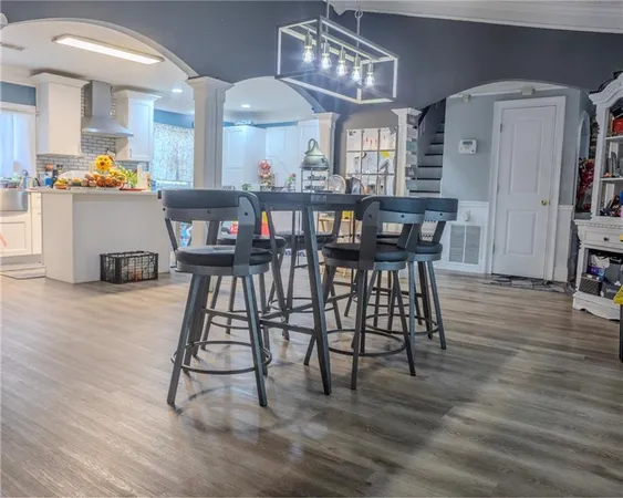 a kitchen with stainless steel appliances a sink stove and refrigerator