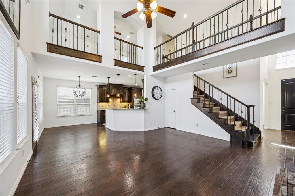 916 Redbird Lane Allen, TX 75013 - Photo 13 of 39 a view of entryway and hall with wooden floor