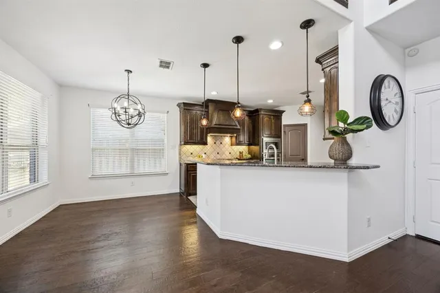 a kitchen with granite countertop lots of counter top space