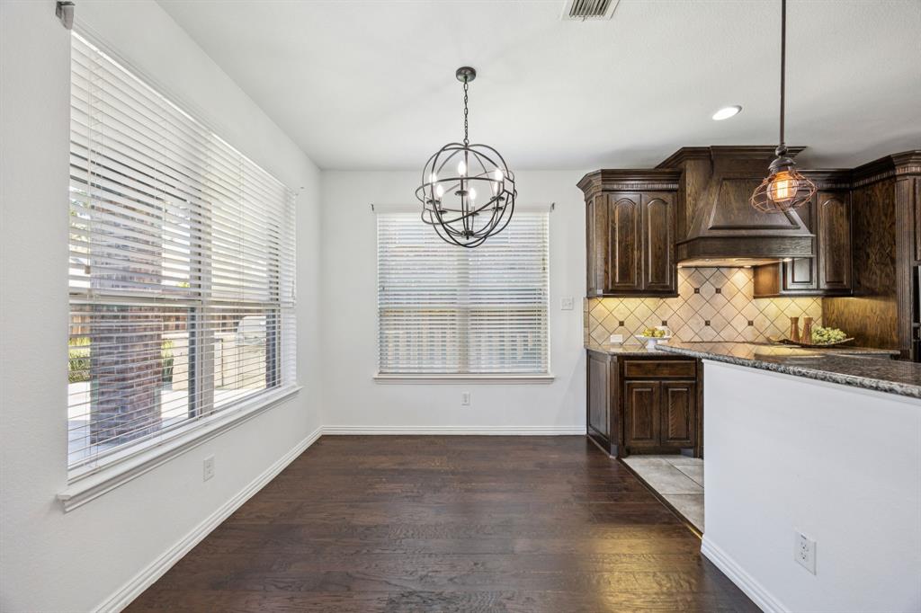 916 Redbird Lane Allen, TX 75013 - Photo 15 of 39 a very nice looking kitchen with a wooden floor and a window