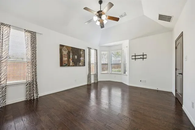 a spacious bathroom with a sink and a mirror