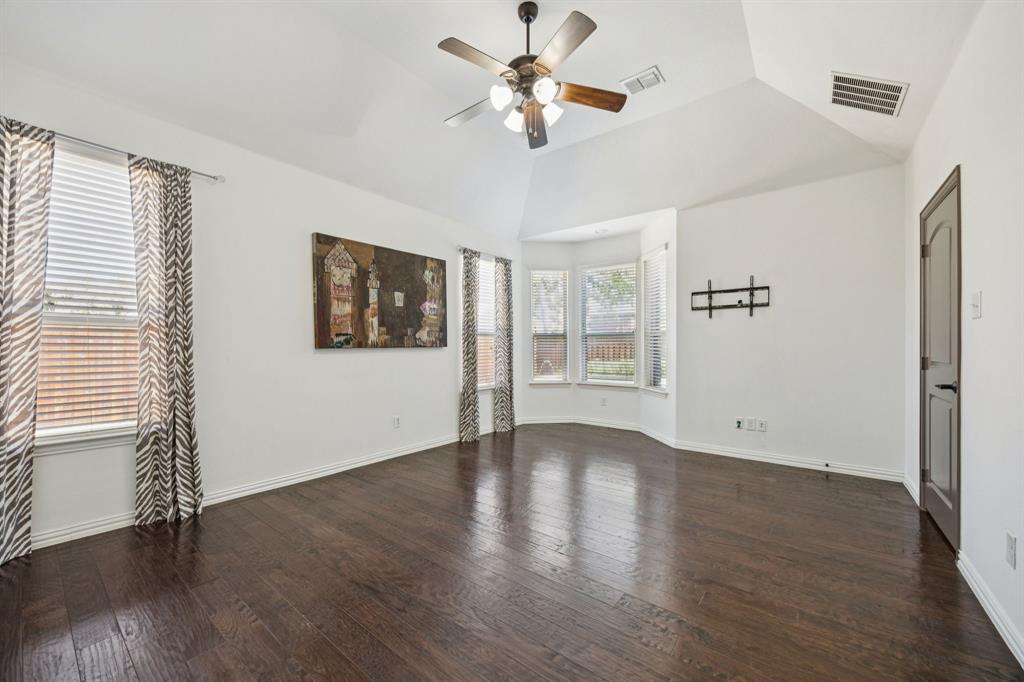 916 Redbird Lane Allen, TX 75013 - Photo 20 of 39 a view of an empty room with wooden floor and a window