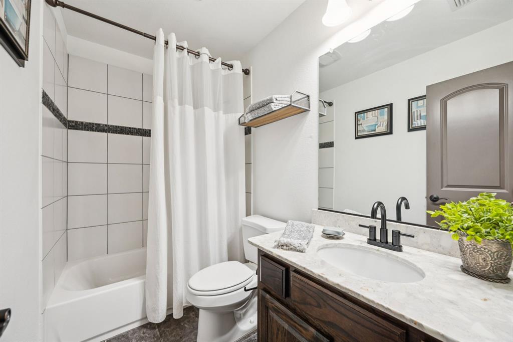 916 Redbird Lane Allen, TX 75013 - Photo 28 of 39 a bathroom with a sink toilet and shower