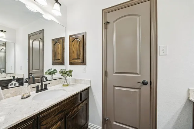 a view of a garden with wooden fence