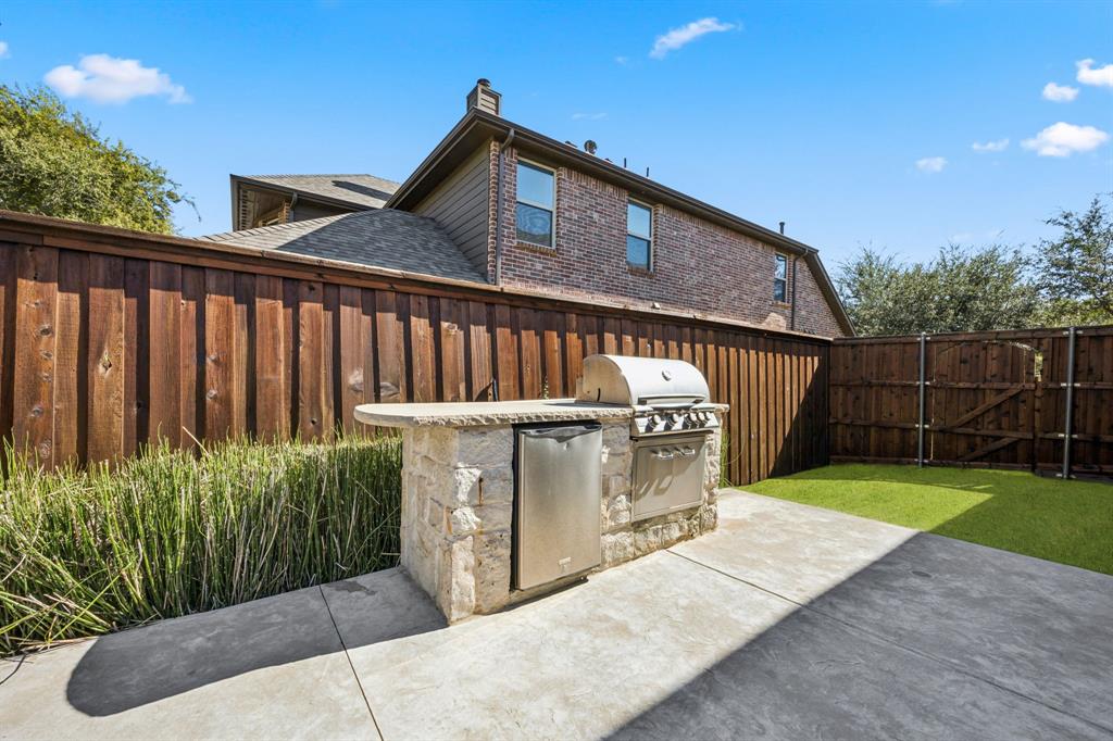 916 Redbird Lane Allen, TX 75013 - Photo 38 of 39 a view of a garden with wooden fence