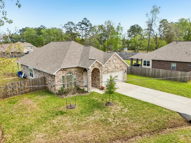 a aerial view of a house with garden