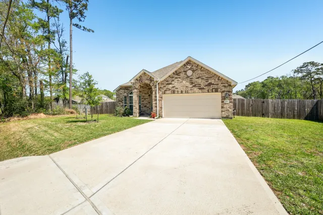 a view of swimming pool with a yard