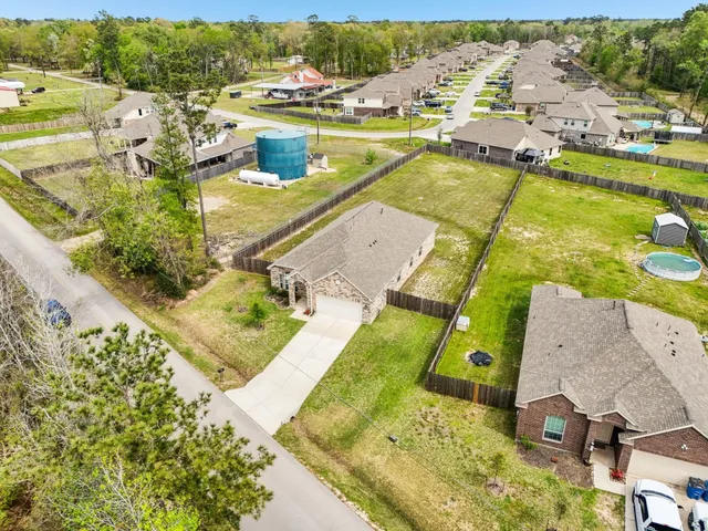 an aerial view of a house with a ocean view