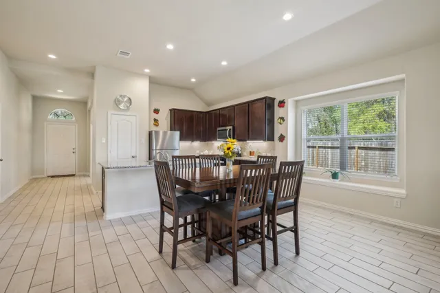 a view of a dining room with furniture window and outside view