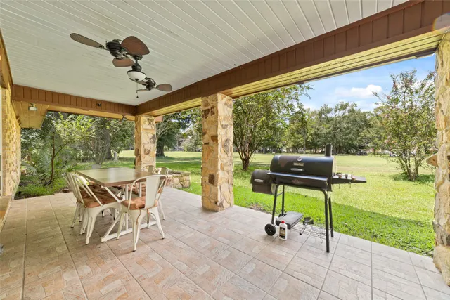 a dining room with furniture and garden view