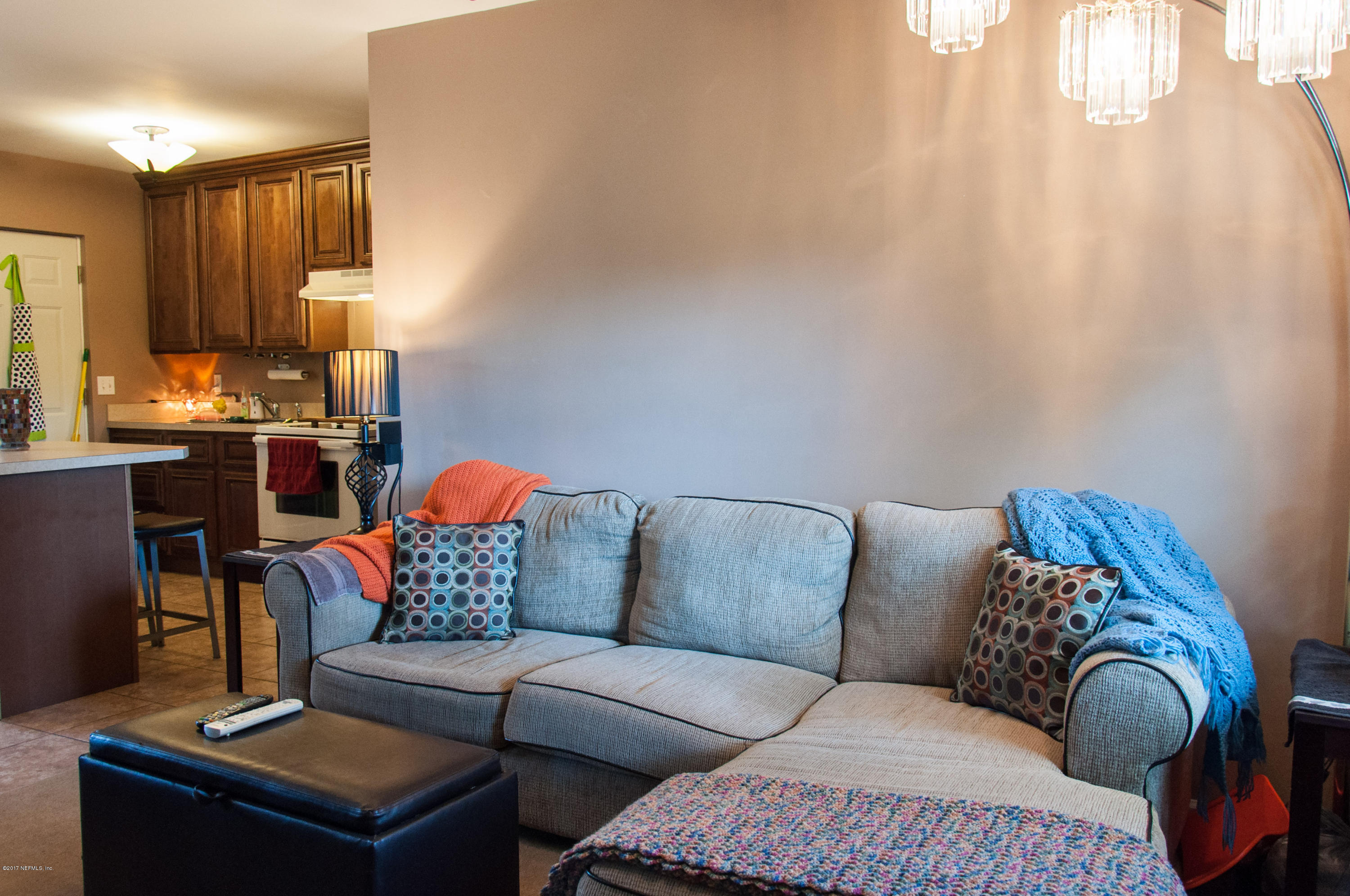 1513 Griflet Road Jacksonville, FL 32211 - Photo 2 of 15 a living room with furniture and a lamp