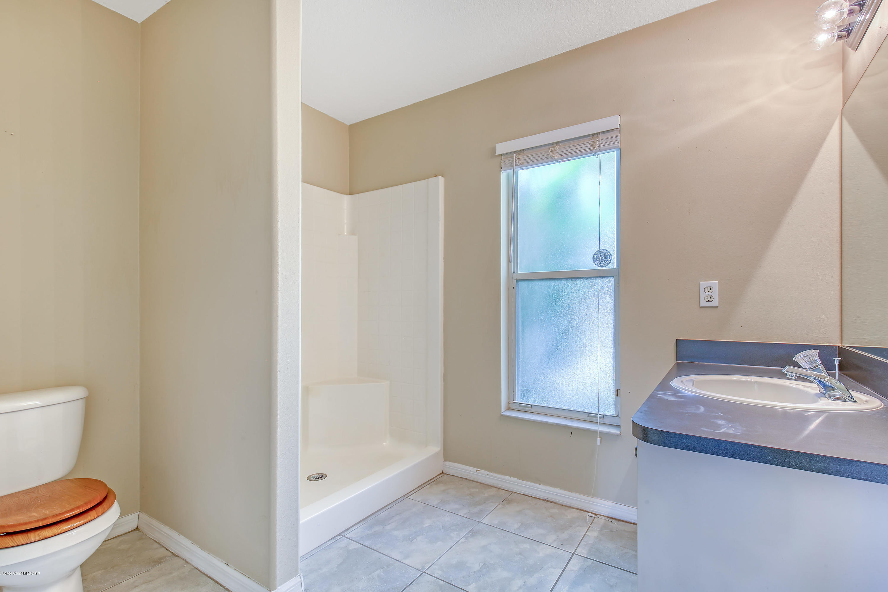 1229 Seabold Road Southwest Palm Bay, FL 32908 - Photo 14 of 24 a bathroom with a sink and a toilet