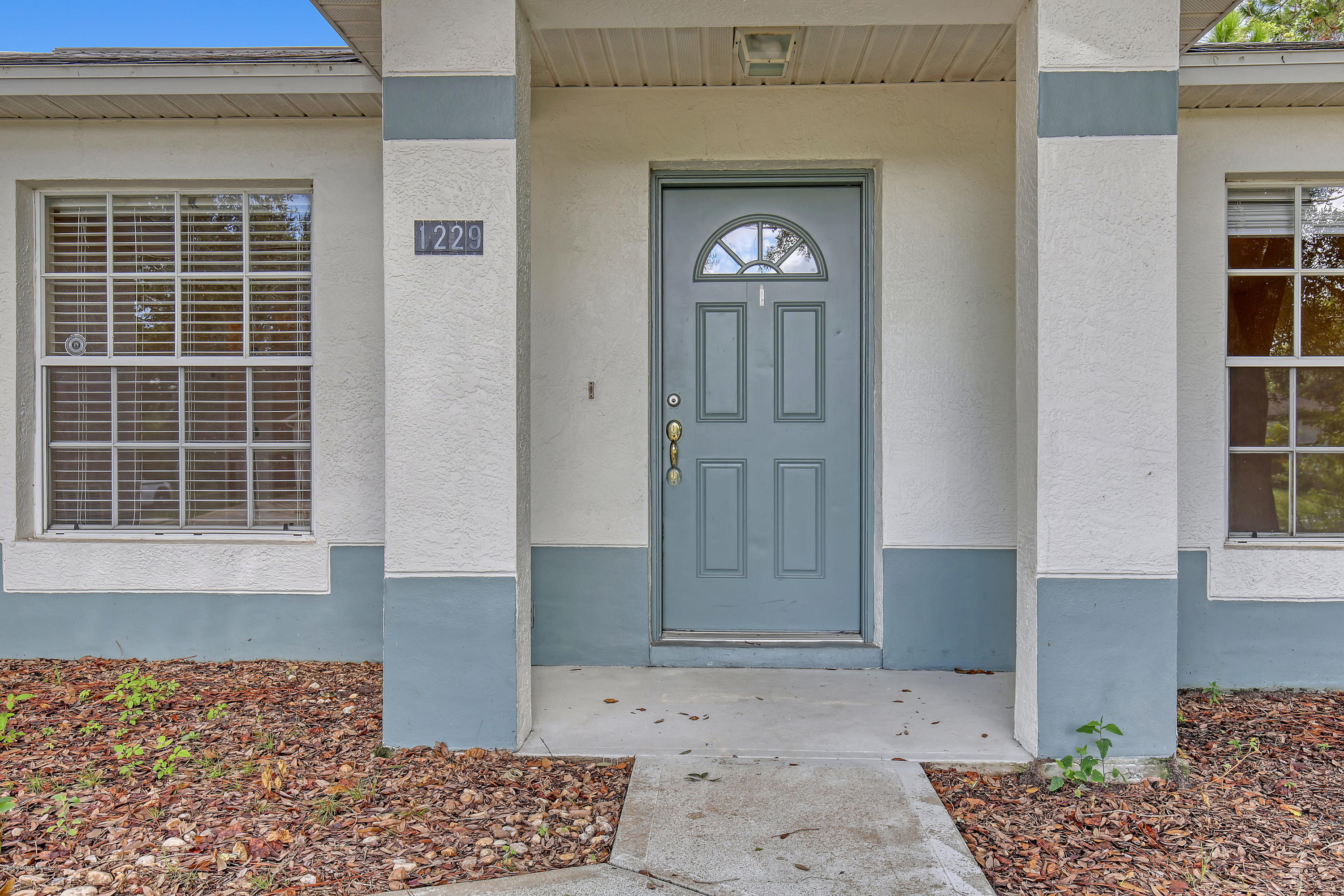 1229 Seabold Road Southwest Palm Bay, FL 32908 - Photo 3 of 24 a view of front door of a house