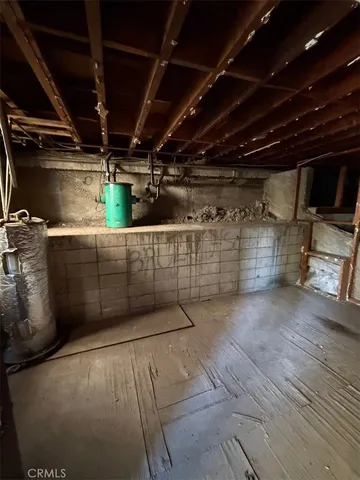 a view of empty room with wooden walls