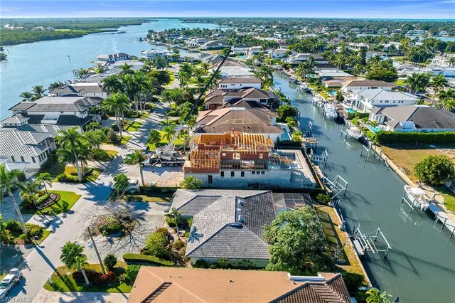 an aerial view of a house with a lake view