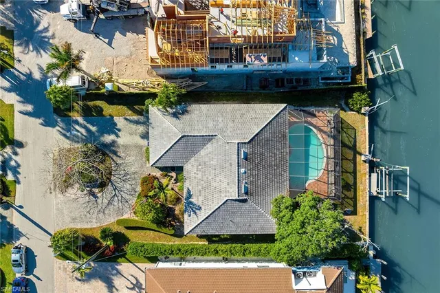 a aerial view of a house with a yard