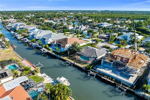an aerial view of a house with a lake view