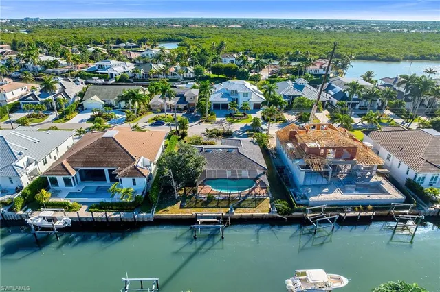 a view of houses with swimming pool and outdoor space