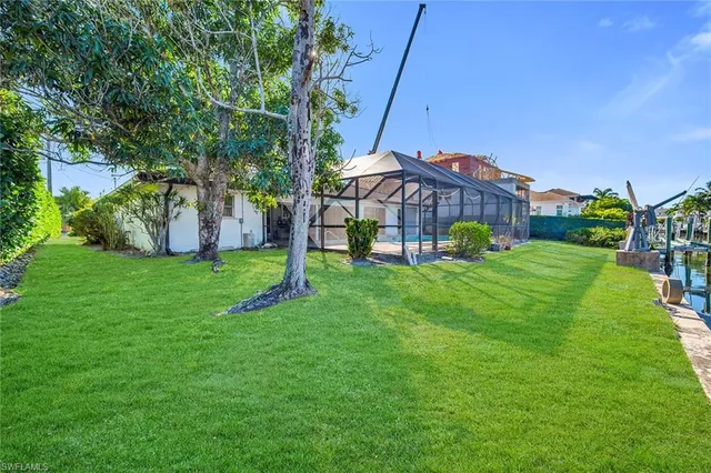 a view of a garden with a house