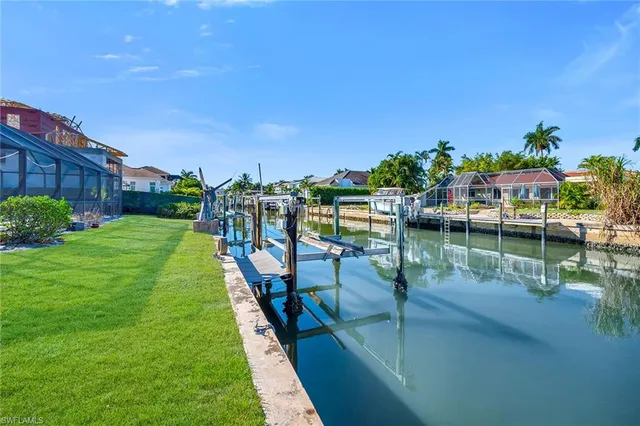a view of a lake with a house in the background