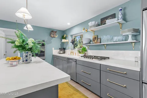 a kitchen with a table and chairs in it
