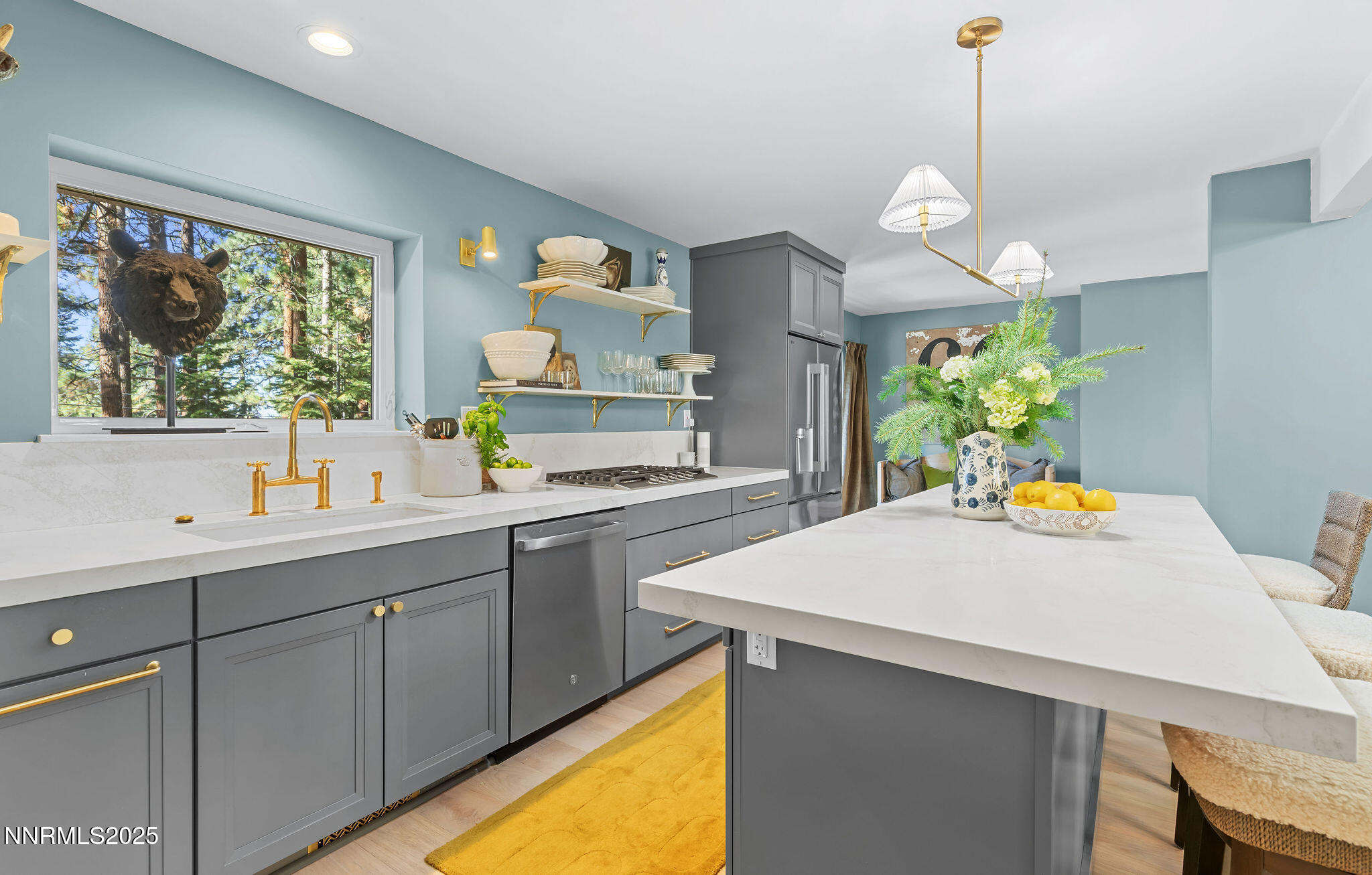 174 Hall Court Stateline, NV 89449 - Photo 13 of 40 a kitchen with a sink a counter top space and living room view