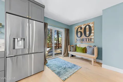 a view of a balcony with chairs and wooden floor